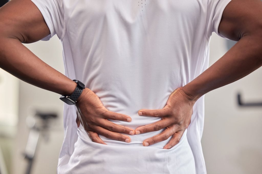 Man with experiencing lower back pain.
