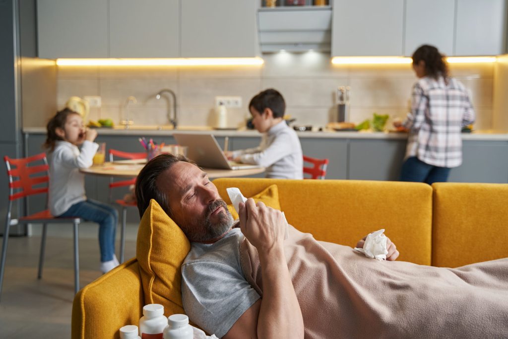Father with muscle loss lying on the couch.