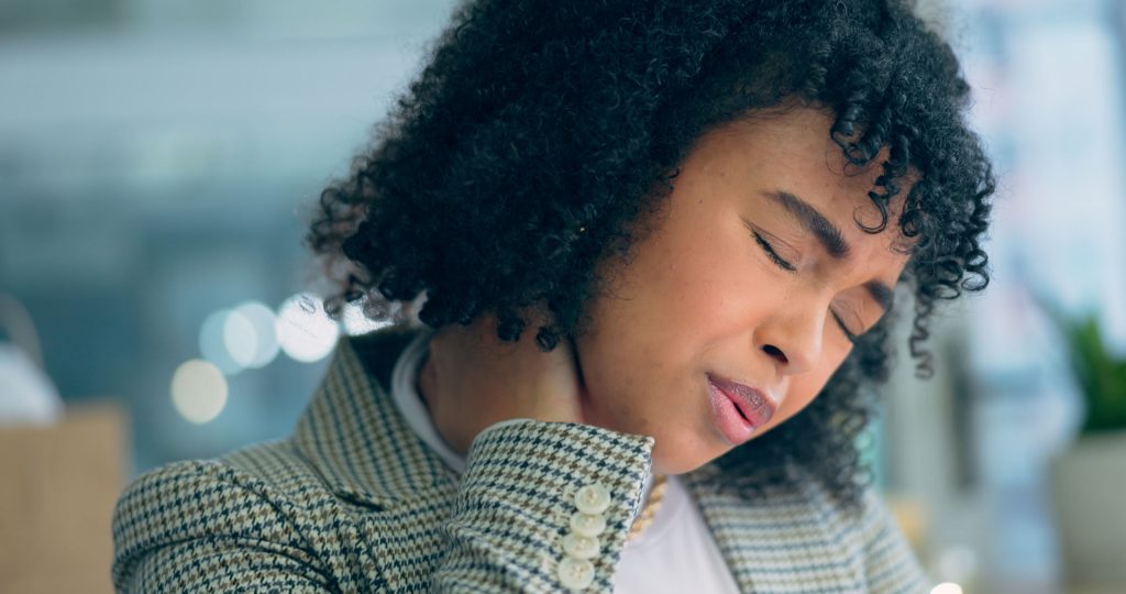 Stressed woman in office.