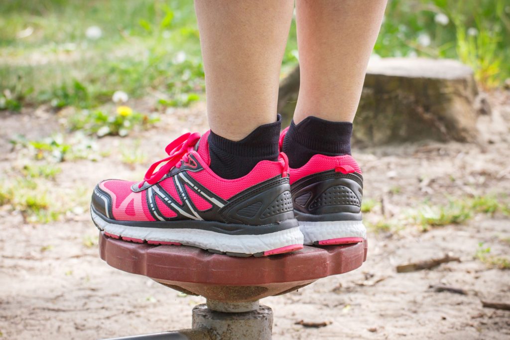 Close-up photo of a person doing balance exercise to avoid balance problems.