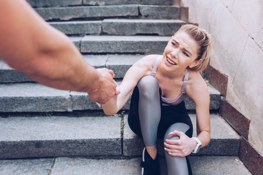 Man giving a helping hand to a woman.