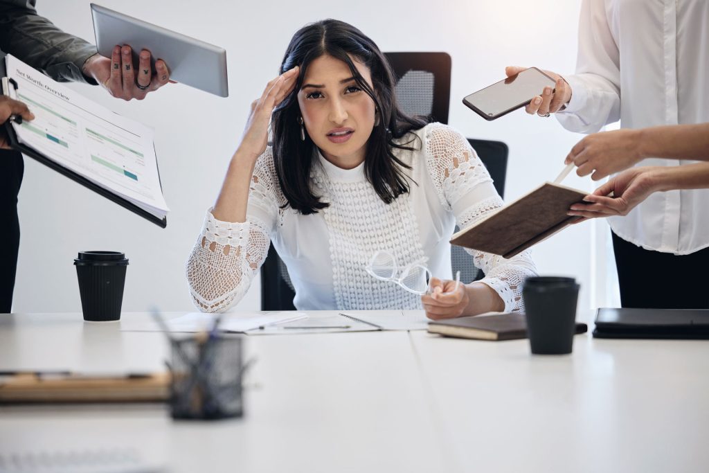 Shot of a young businesswoman with poor mental health, stressed out.