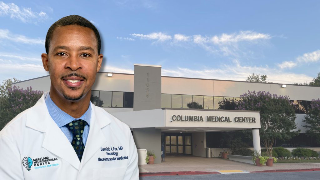 Dr. Fox in front of Columbia Medical Center bldg.