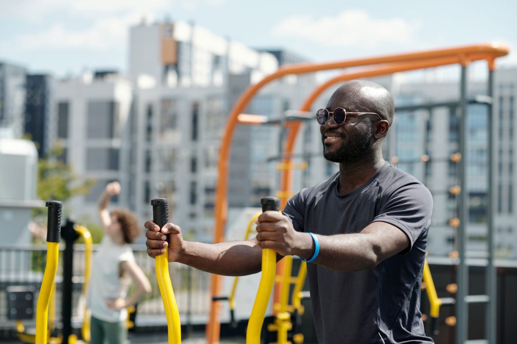Healthy young sportsman in sunglasses.